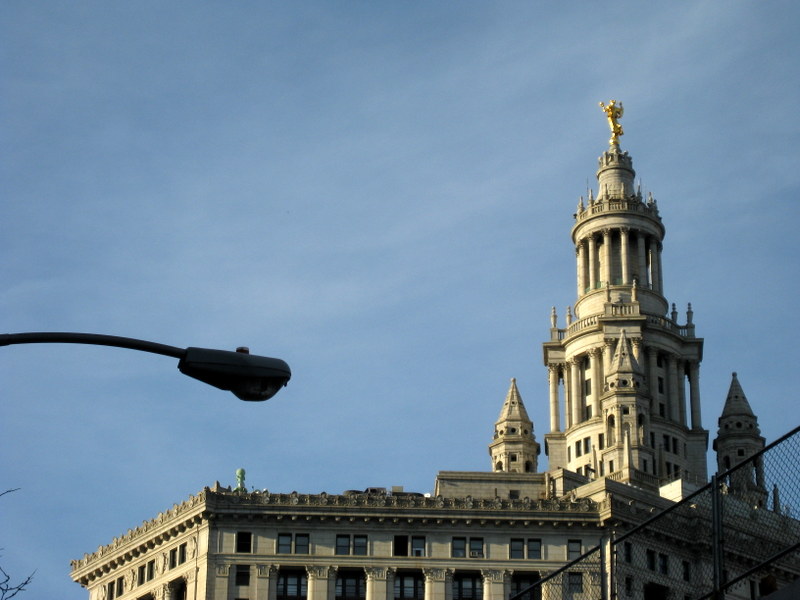 A 25-foot tall woman, Civic Fame, tops the city's Municipal Building
